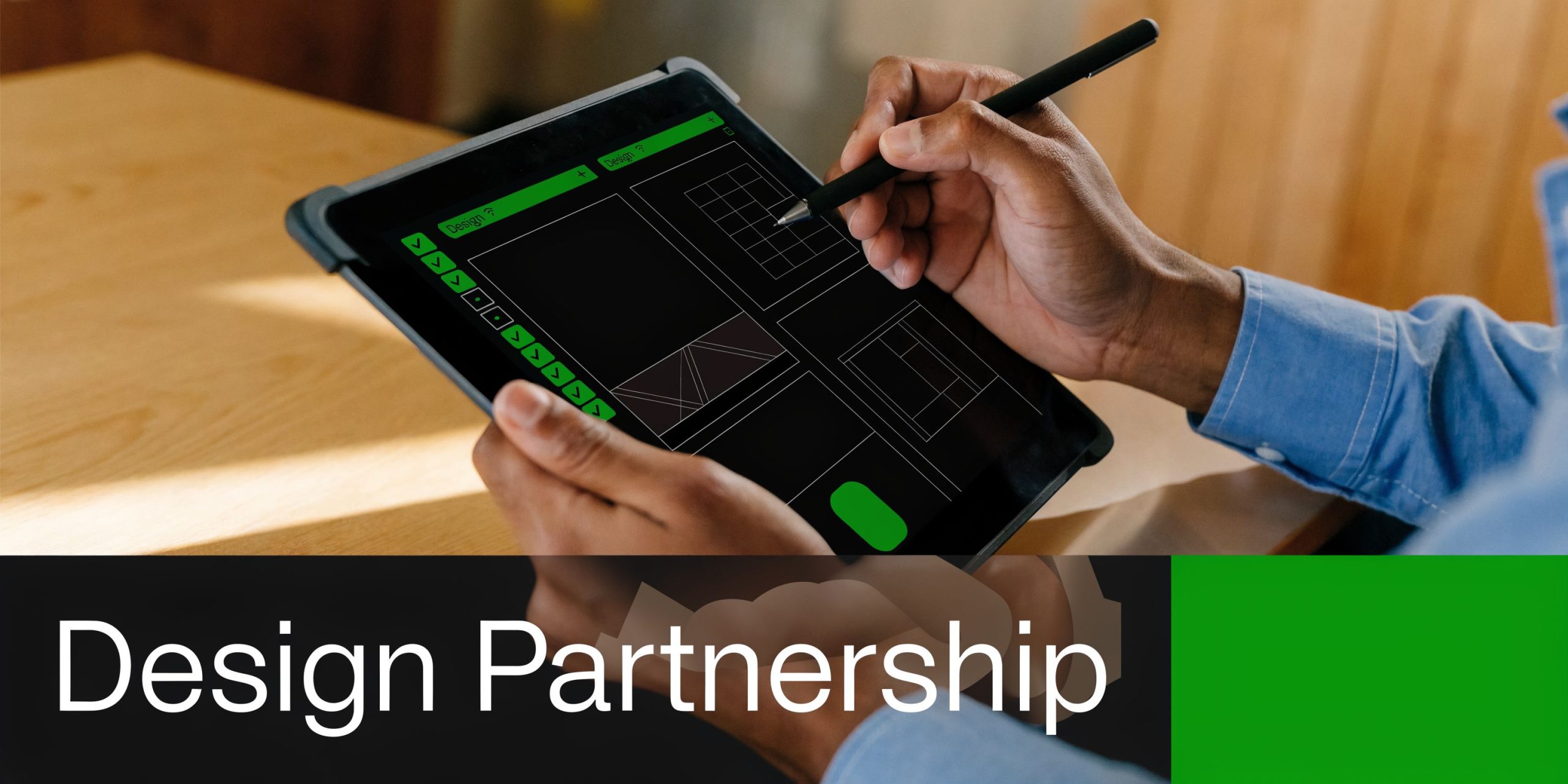 A person using a stylus pen on a tablet to design graphics on a creative interface.