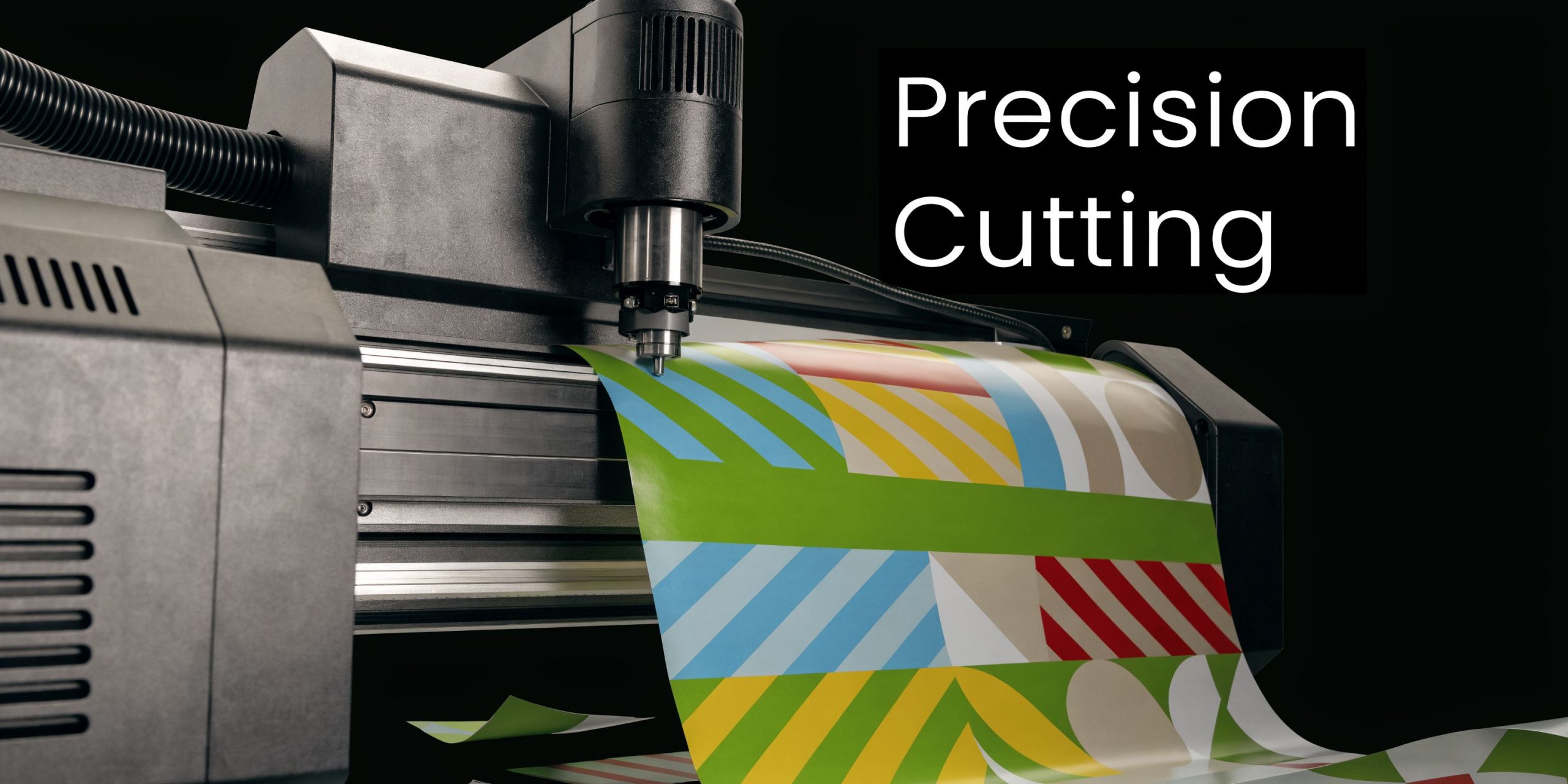 A professional precision vinyl plotter machine cutting intricate geometric patterns on a colorful adhesive material sheet.